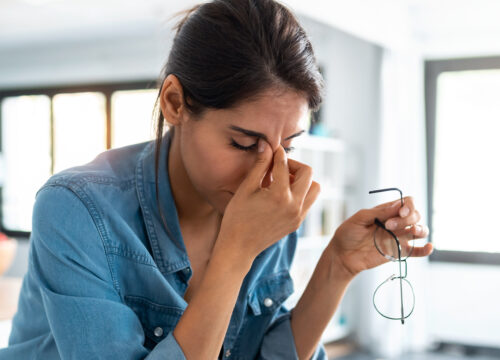 Photo of a woman feeling fatigue at work
